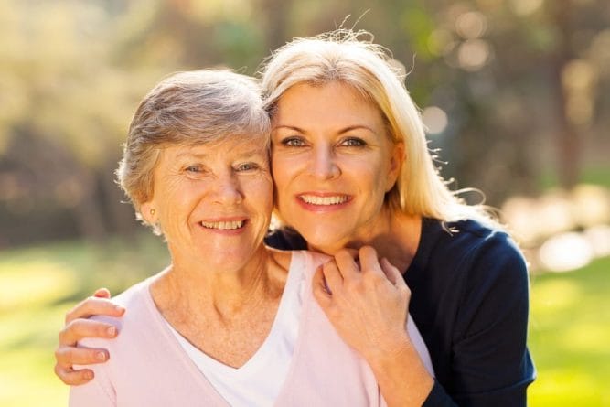 Keywords Used: Quality of Life, Seniors

Description: Enhancing seniors' quality of life through a heartwarming embrace between two older women in a serene park setting.