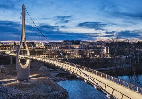 A bridge over a river at dusk.
